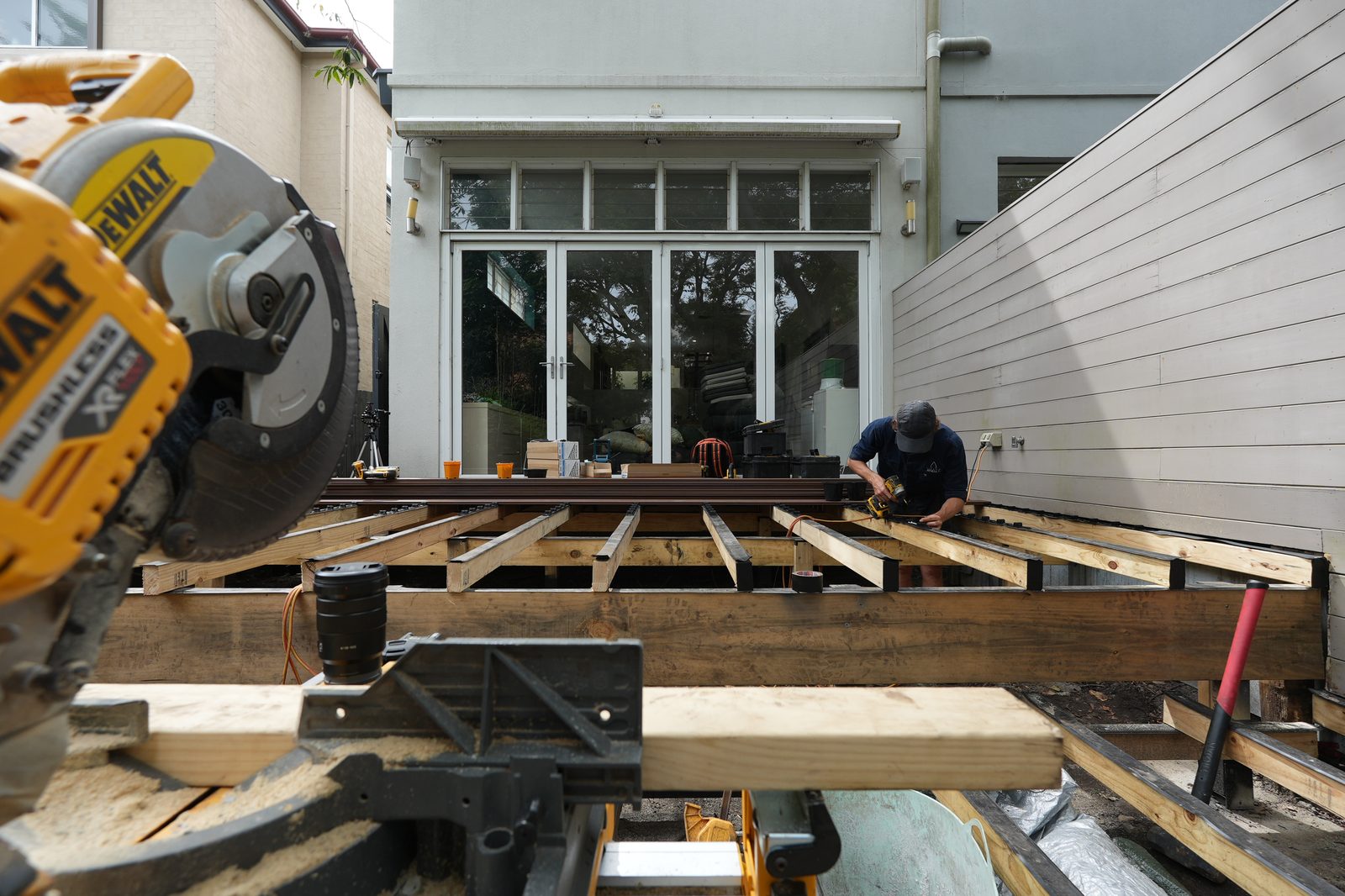 Hardwood deck substructure in progress, Piper Moss joists and DeWalt mitre saw setup, Sydney